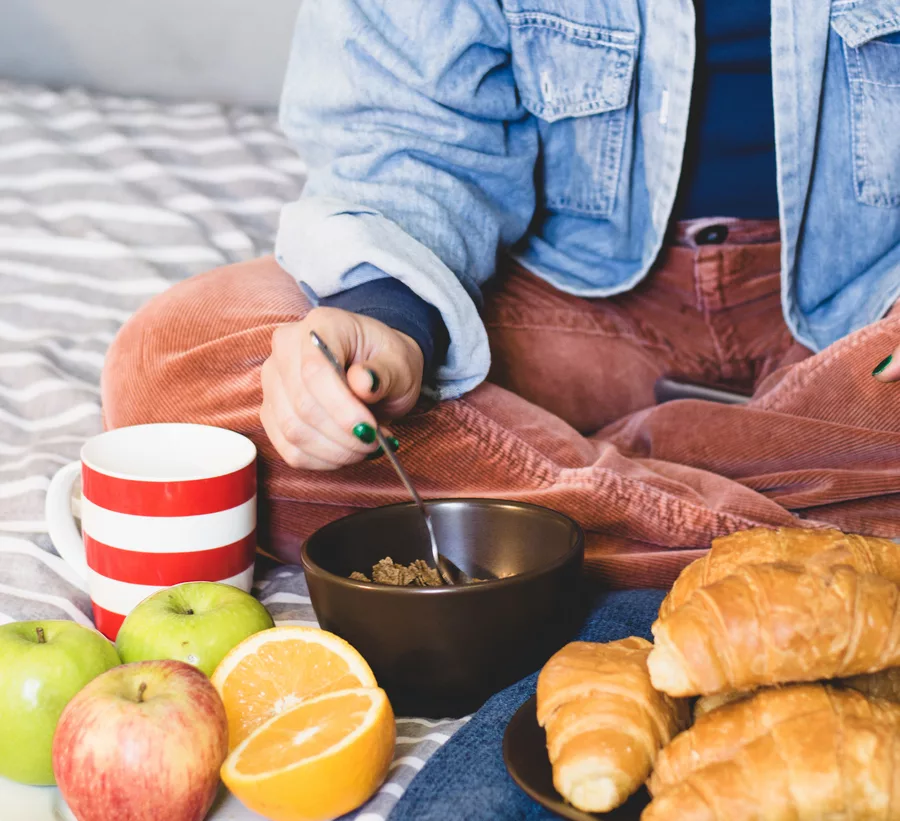 woman sitting with breakfast food